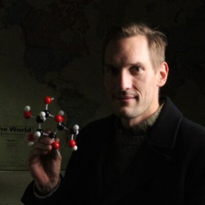 Jason with a model of a cellulose molecule, the most abundant organic compound on Earth, and one of the materials his company utilizes to deliver carbon-conscious alternatives to traditional design and structures.